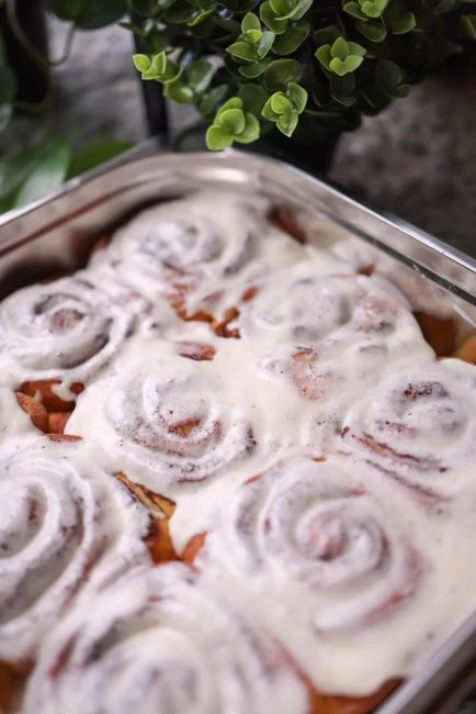Freshly baked cinnamon rolls with icing